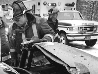 Honorary Member and Captain Dale Zahner is shown inspecting a car and telephone pole after a crash on Walbridge Hill Road about three decades ago.The TFD announced his passing Tuesday. 