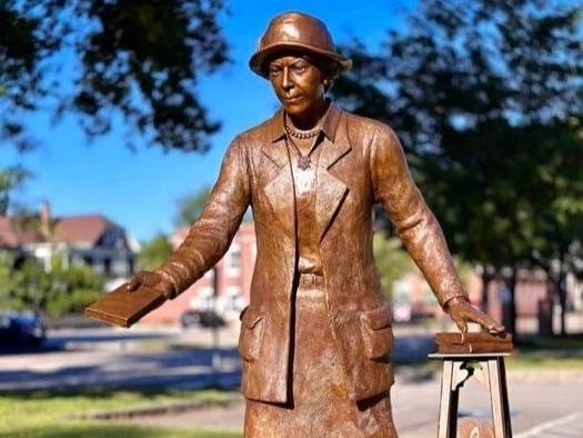 Manchester educator Elisabeth Bennet is honored on the lawn Bennet Academy. 