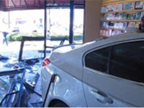 A car slammed into Munson's Chocolates' Glastonbury store Monday. 