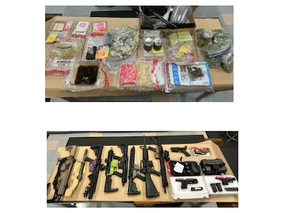 What began as a child porn arrest turned into the seizure of guns and drugs at a Manchester home Monday, police said. 