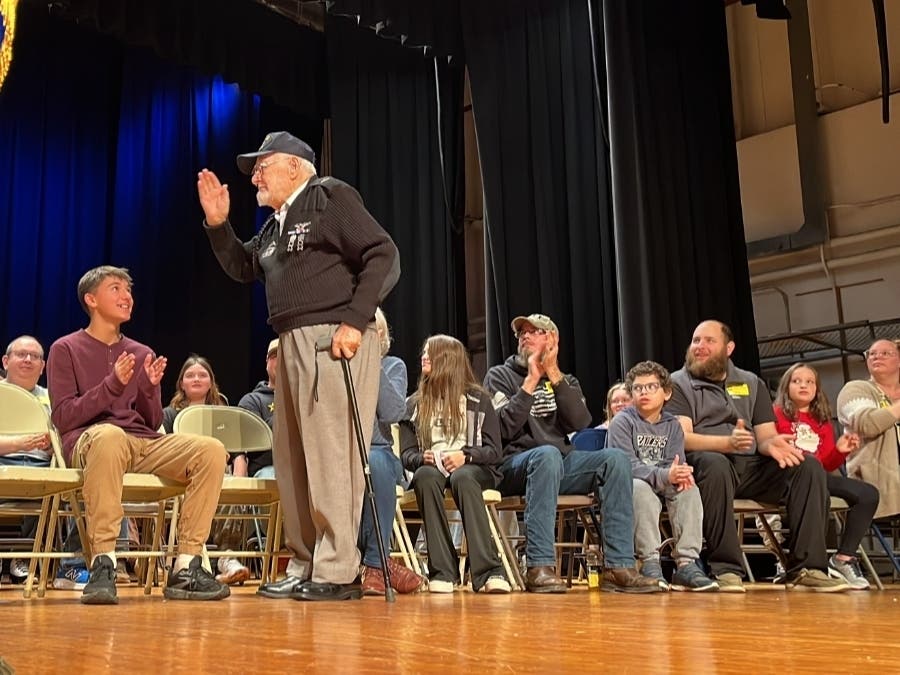 Robert Garabedian responds to a 100 birthday celebration with a salute Monday at VCMS. 