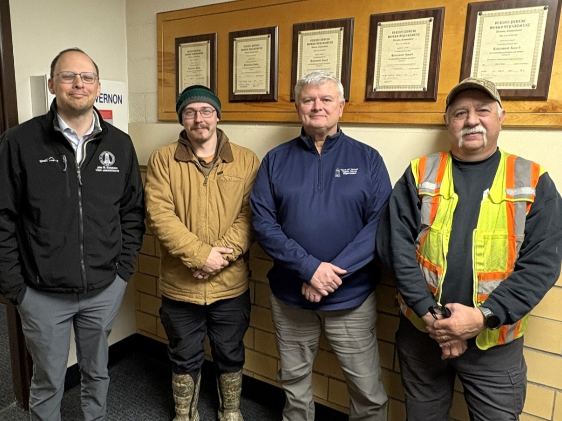 Town Administrator John Kleinhans, Doug Haiko, Public Works Director Dwight Ryniewicz and Lead Foreman Jeff Schambach (from left), after Haiko's heriocs Thursday.  