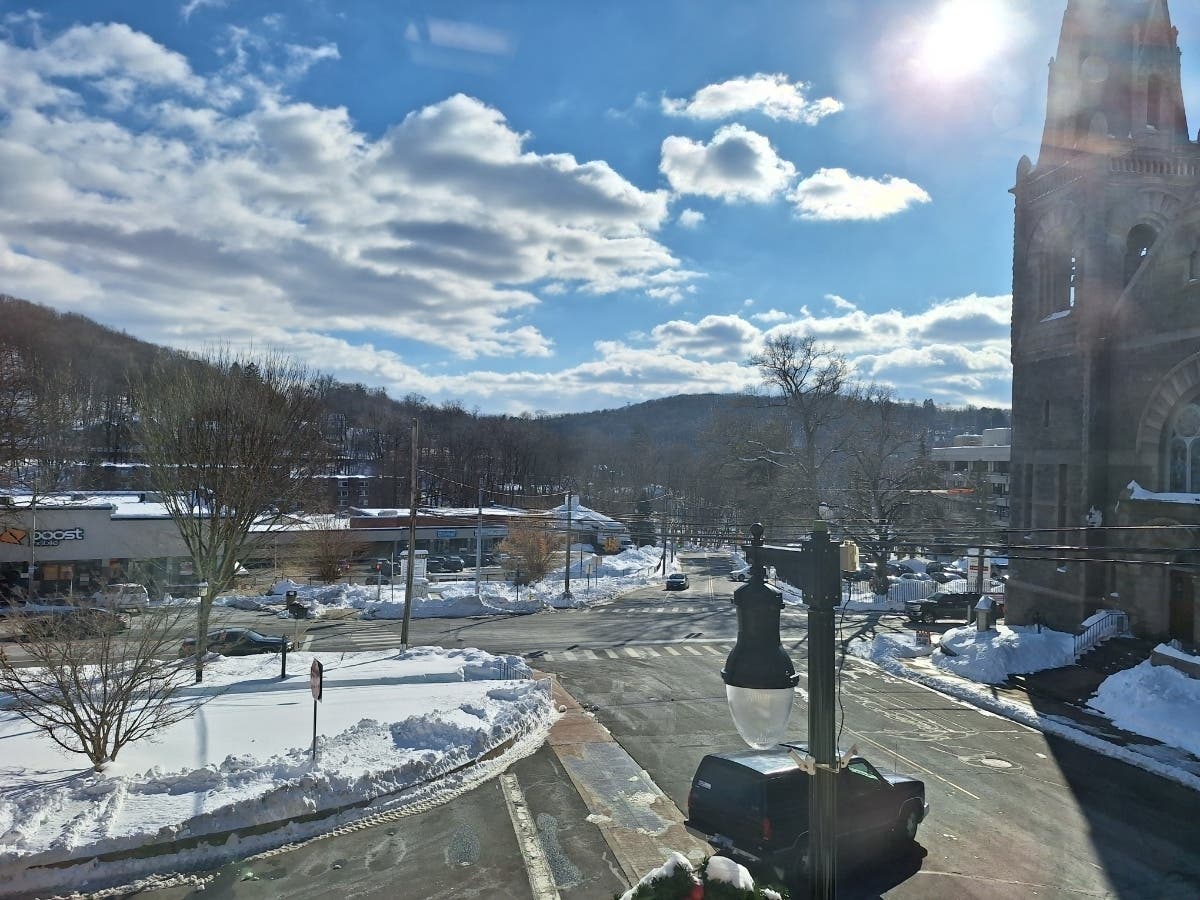 A view from a development department office in the Citizens Block at a moving truck being loaded at 55 West Main St. 