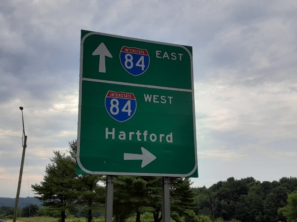 Interstate 84 was closed for seven hours Thursday morning while state police pieced together a crash between a car and tractor-trailer.