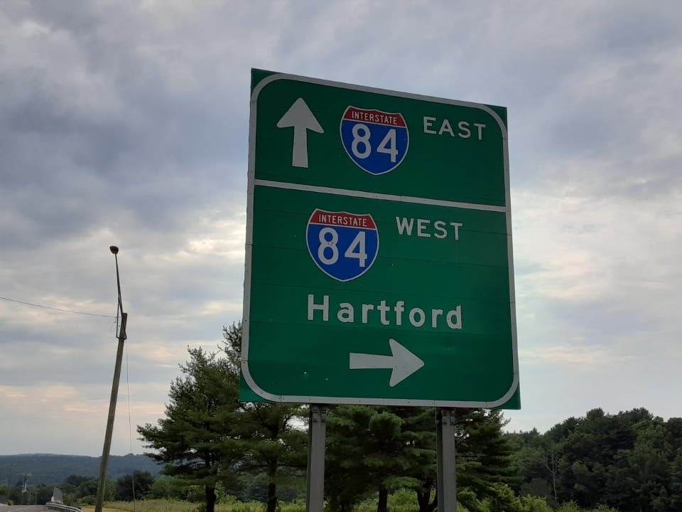 A truck tire flew into a car on a stretch of I-84, state police said. 