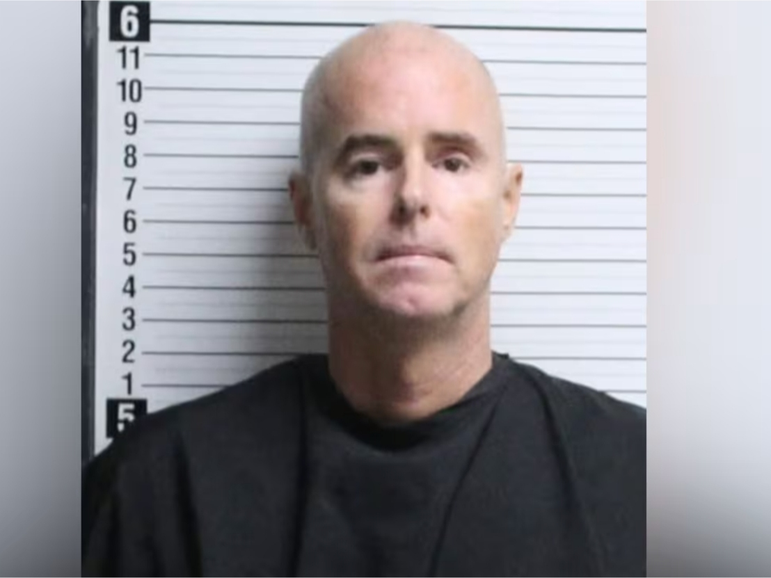 The Booking Image of Justin Newman.