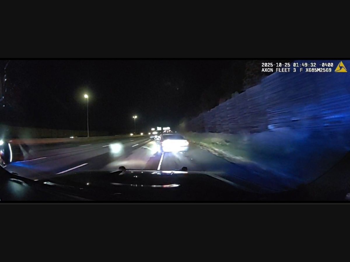 A dash cam image of what the DCJ says is Samuel Lee firing at a Manchester police cruiser in October.