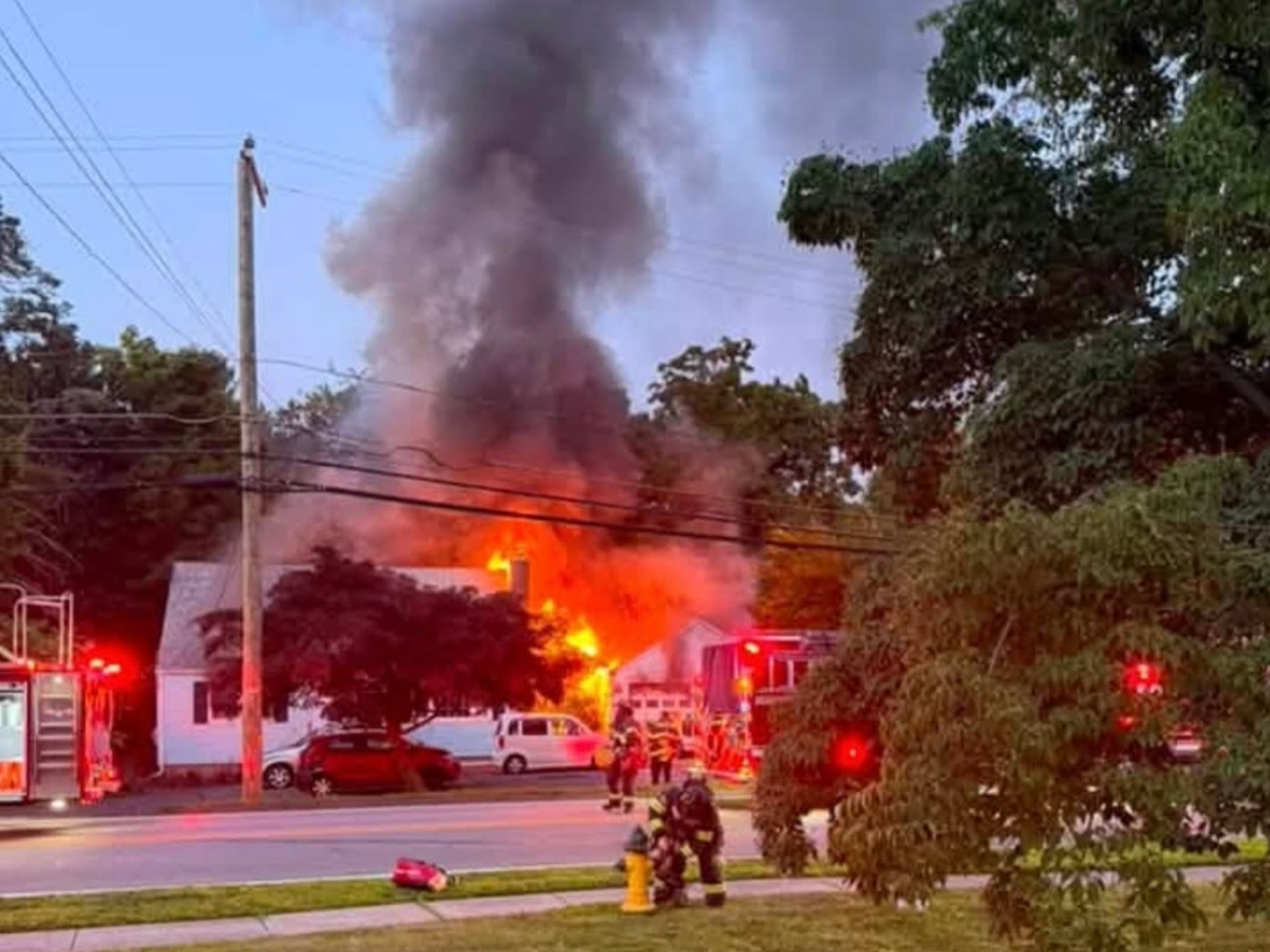 Four people escaped the East Street fire, and one firefighter suffered minor burns, according to Westfield fire officials.
