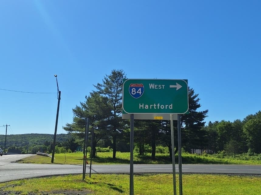 A tractor-trailer ran over several signs on a ramp in Willington, according to a crash report.