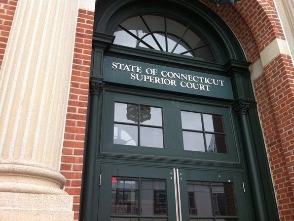 The mom of a Coventry teenager who had been facing a felony criminal charge and others in connection with a Tolland man being hit by a car while removing snow on his road over the winter has been charged with evidence tampering, according to a warrant.