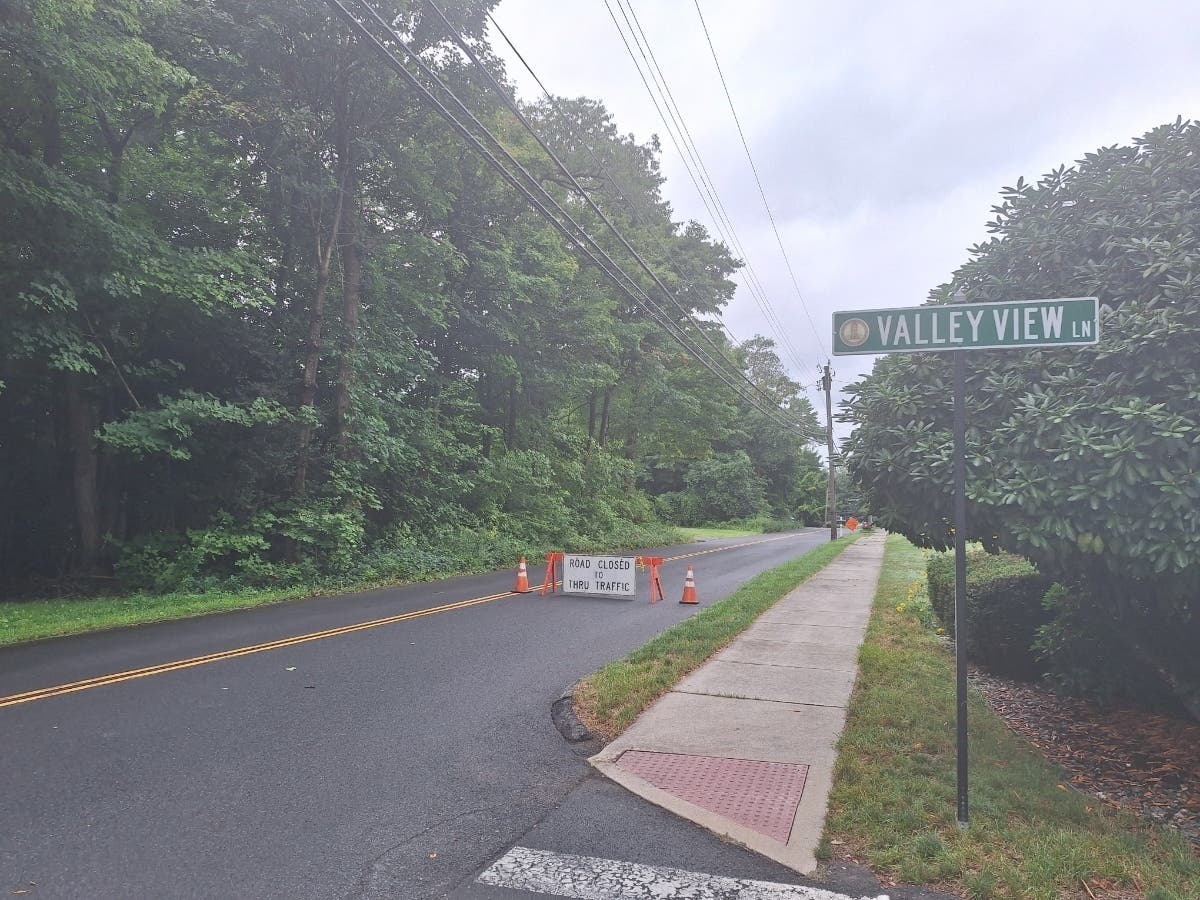 Despite morning mist, paving was taking place on Center Road and the Peterson fork in Vernon Monday.