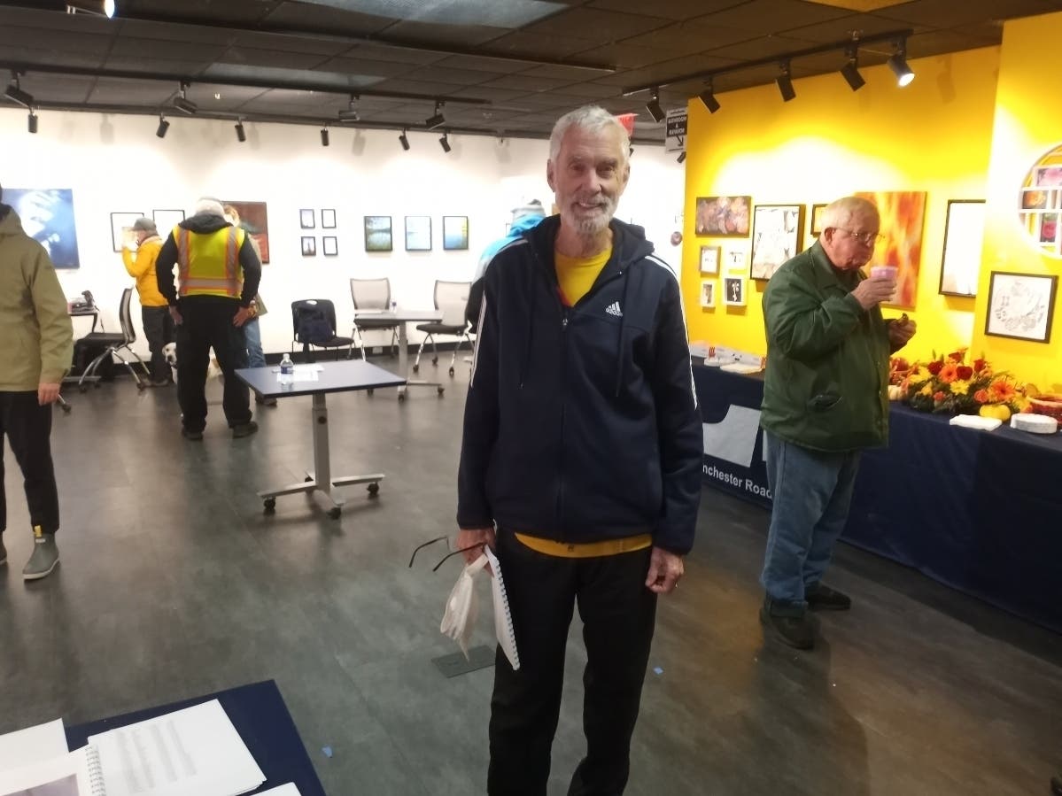 Amby Burfoot in the Manchester Road Race media center in 2024. 