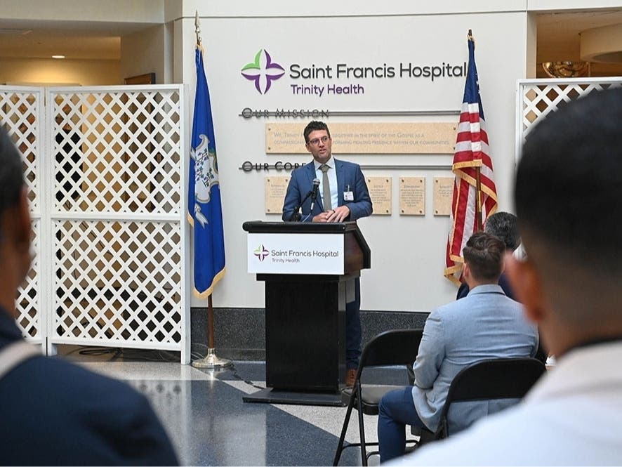 Robert Roose, MD, MPH, President, Acute Care, Trinity Health Of New England, speaks to colleagues and guests at a press conference at Saint Francis Hospital on Wednesday.
