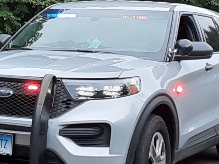 A parking lot mishap left a car crashed at a farm stand in Tolland and a pedestrian hurt, state police said.