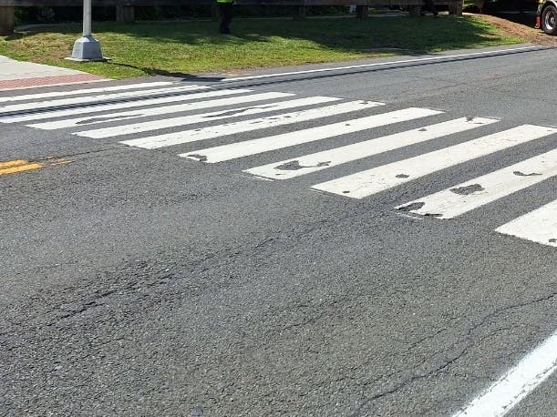Glastonbury will install high-visibility pedestrian crossing flags at five mid-block crosswalks next week as part of a pilot program aimed at improving pedestrian safety.