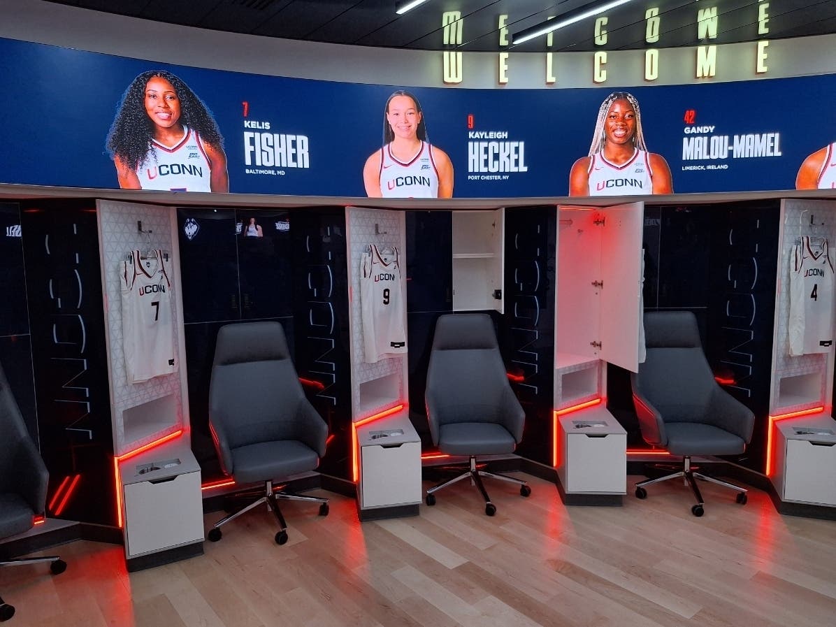 University of Connecticut Athletic Director David Benedict Friday showed off the posh new dressing room and other game day facilities.
