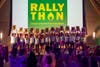 Students holding up the total amount raised at the conclusion of UVM's 12-Hour Dance Marathon, RALLYTHON.