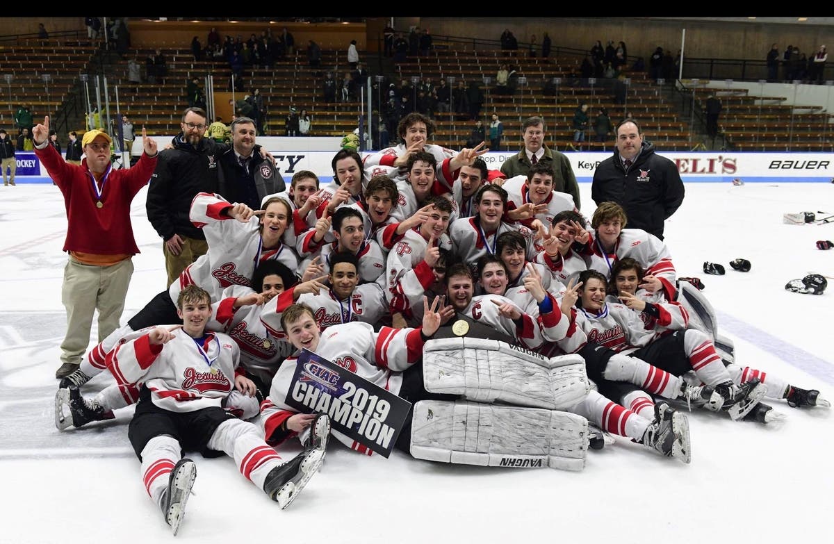 Fairfield Prep players and coaches celebrate their second straight Division I championship.