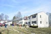 Firefighters work at 56 Elm St. in Enfield.