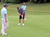 Former PGA TOUR standout Brian Davis putts as Eric Dietrich of Cheshire and Andrew Gai of Westport look on.