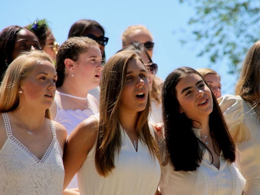Stehanie Makowski (center) and Isabella Manganiello (right) of Avon graduated from The Ethel Walker School in Simsbury.