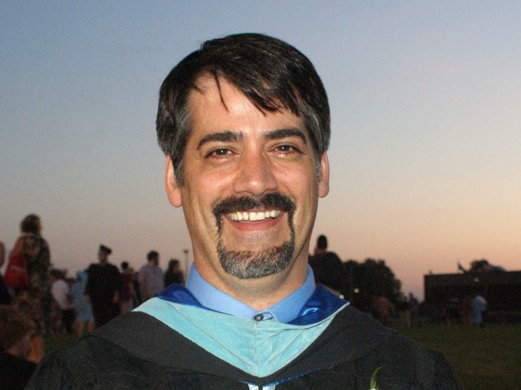 John Coccia, shown during his tenure as assistant principal at Enrico Fermi High School during the 2013 graduation.