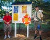 Max Dumont and assistant Scoutmaster Rick Gorman at one of the two lifesaving stations created for Dumont's Eagle badge project.