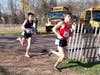 Gavin Sherry of Conard leads Robbie Cozean of Xavier heading into the final 250 meters; the West Hartford runner won by six seconds.