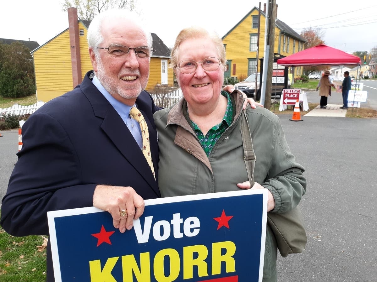 Republican First Selectman Bud Knorr greets former registrar of voters Joan Sizer.