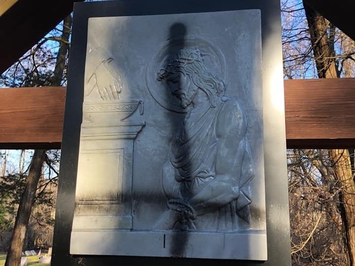 An upside-down cross spray painted on the Holy Family Passionist Retreat Center grounds.