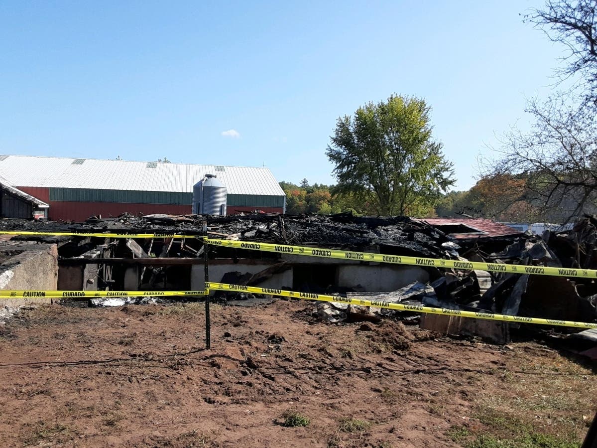 The ruins of a horse barn in Ellington 24 hours after it was destroyed by fire.