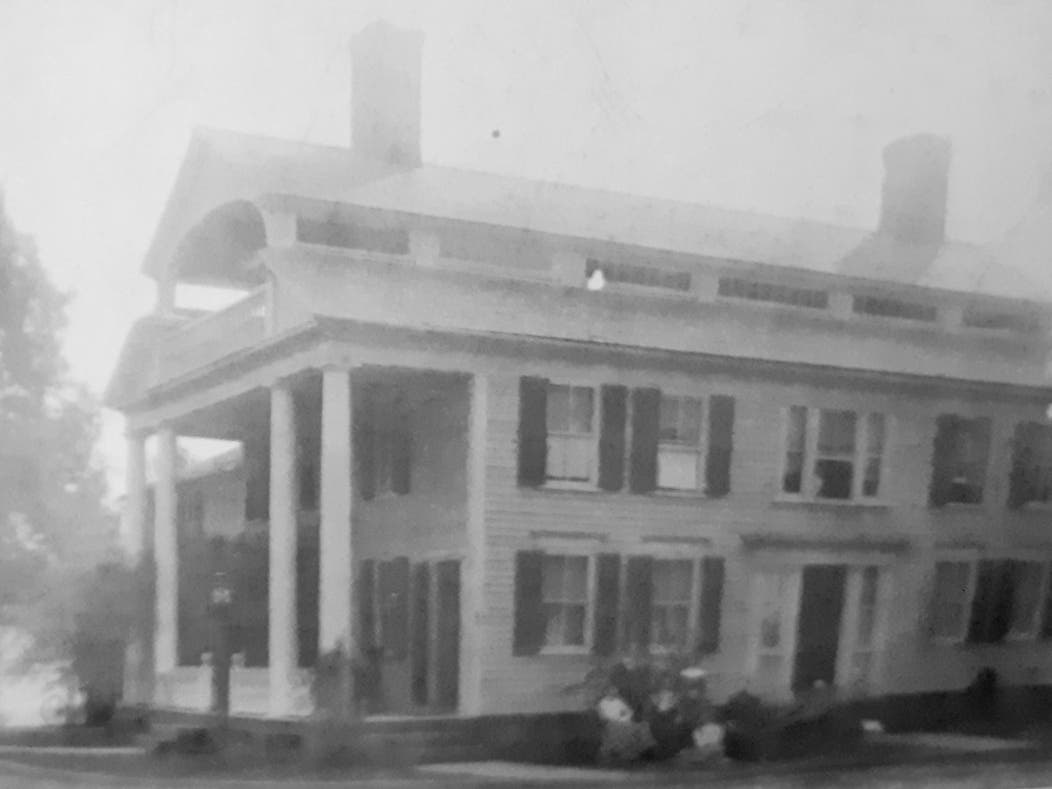 A former tavern and later town offices, demolished to make way for a gas station.