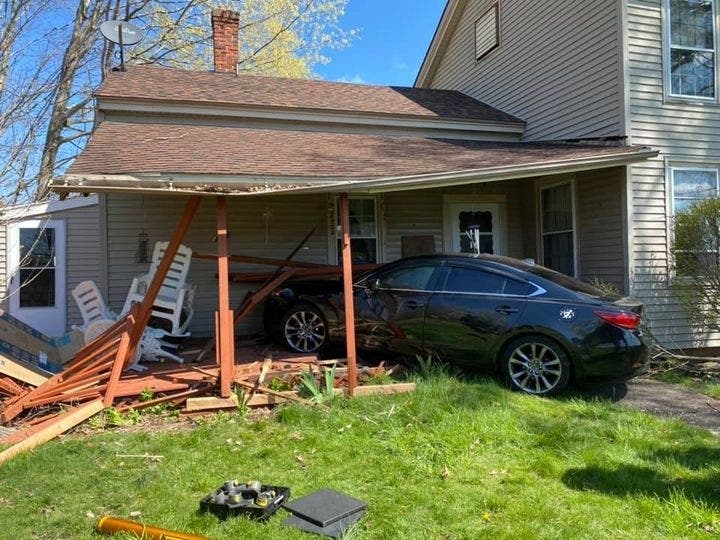 A car crashed into a house on Main Street in East Berlin Friday morning, damaging a porch and its roof.
