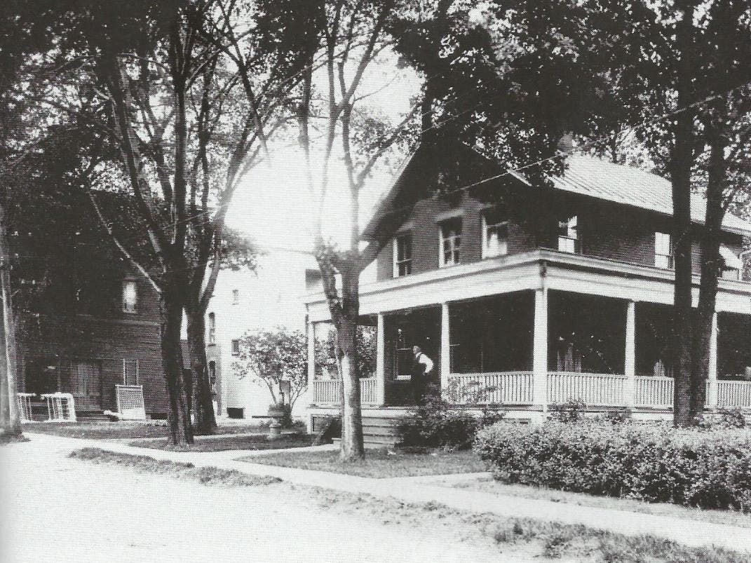 An old house and business building on Oak Street in Windsor Locks.