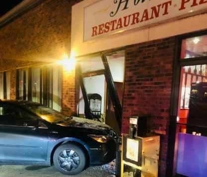 A car crashed into the front door of Holiday Restaurant in Ellington Wednesday night.