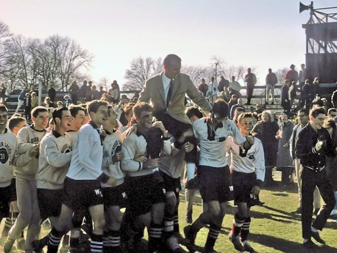 Legendary Windsor Locks coach Dan Sullivan is carried off the field by his jubilant players after winning the Class M soccer championship in 1963.