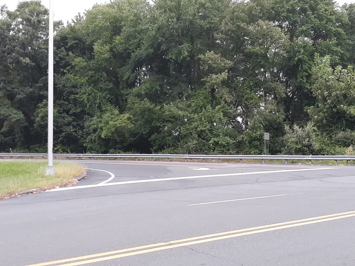 The body of a man was found in a vehicle at this spot on the I-91 Exit 42 off-ramp Sunday evening, according to state police.