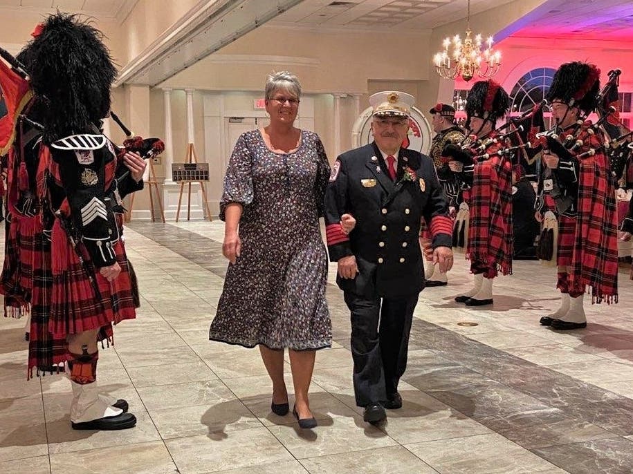 Enfield Fire Chief Ed Richards enters the Aqua Turf ballroom at the Hall of Fame induction ceremony Thursday night.
