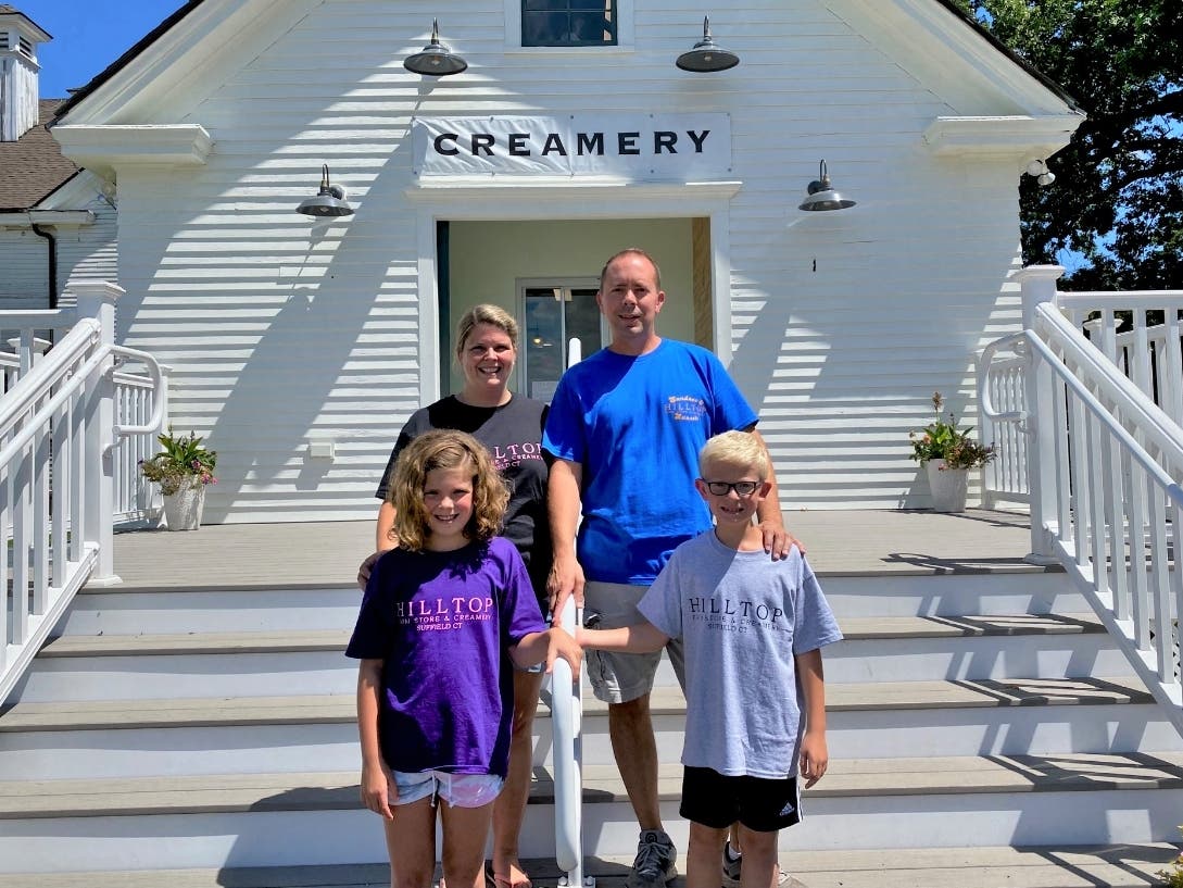 Crystal and Jason Siemienkowicz, shown with their children Brooke and Benjamin, are owners of Hilltop Farm Store and Creamery, located at Hilltop Farm in Suffield.