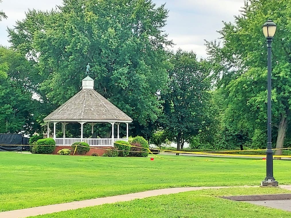 Police are investigating an "apparent homicide" after a body was discovered early Wednesday morning inside the gazebo at the Enfield town green.
