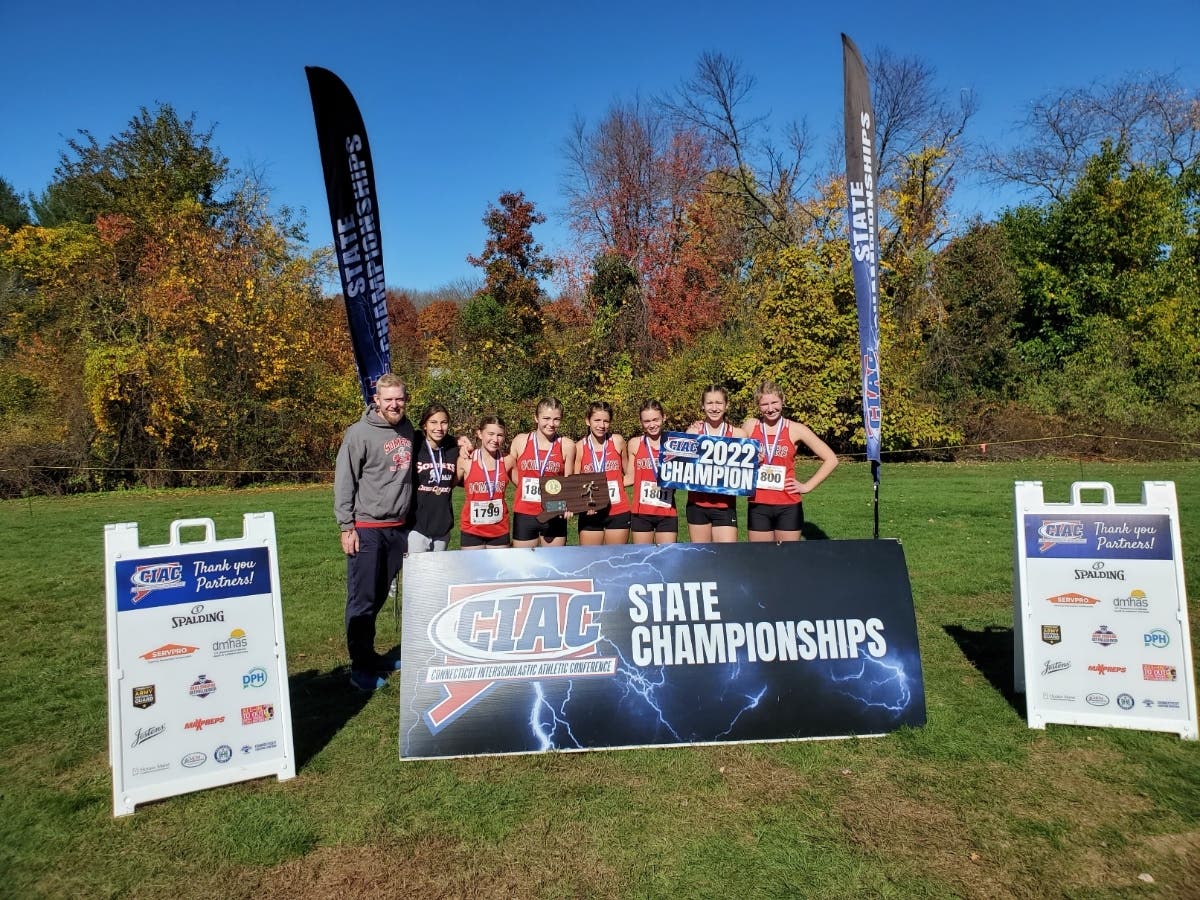 Members of the Somers High School girls cross country team, which won the Class S team title for the second straight year.