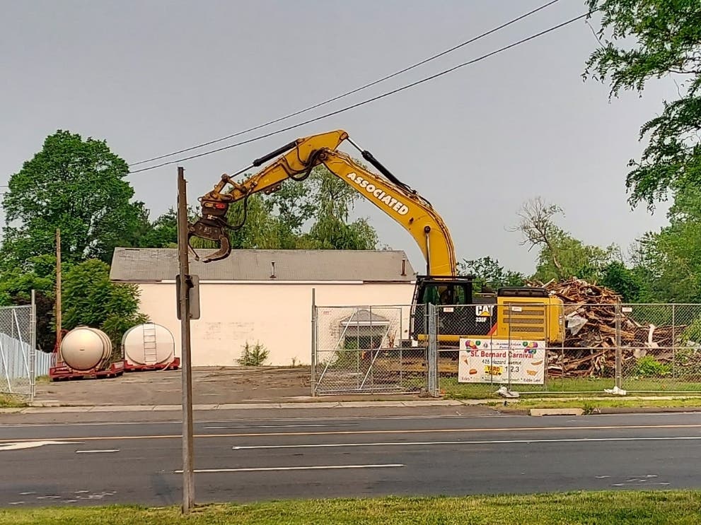 The 8,300-plus square foot main building which formerly housed Laurel House Furniture on Route 5 in Enfield was torn down Tuesday and Wednesday.