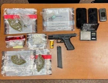 Evidence including weapons and narcotics seized following a vehicle and foot pursuit Monday evening.