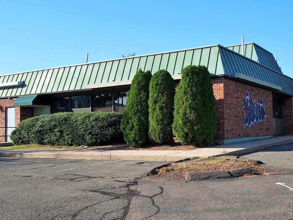 The Enfield Planning and Zoning Commission unanimously approved conversion of an old bank and restaurant building into a marijuana dispensary.