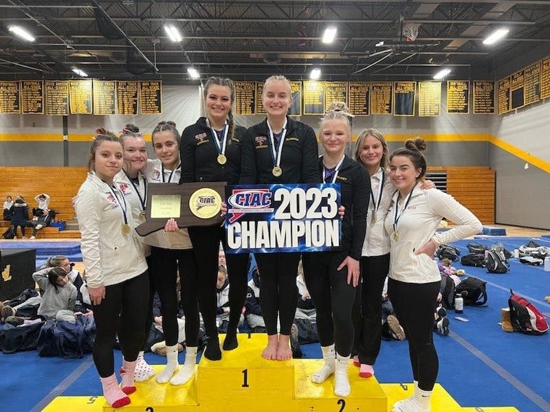 The Ellington/Tolland gymnastics team won its first Class M title in March.