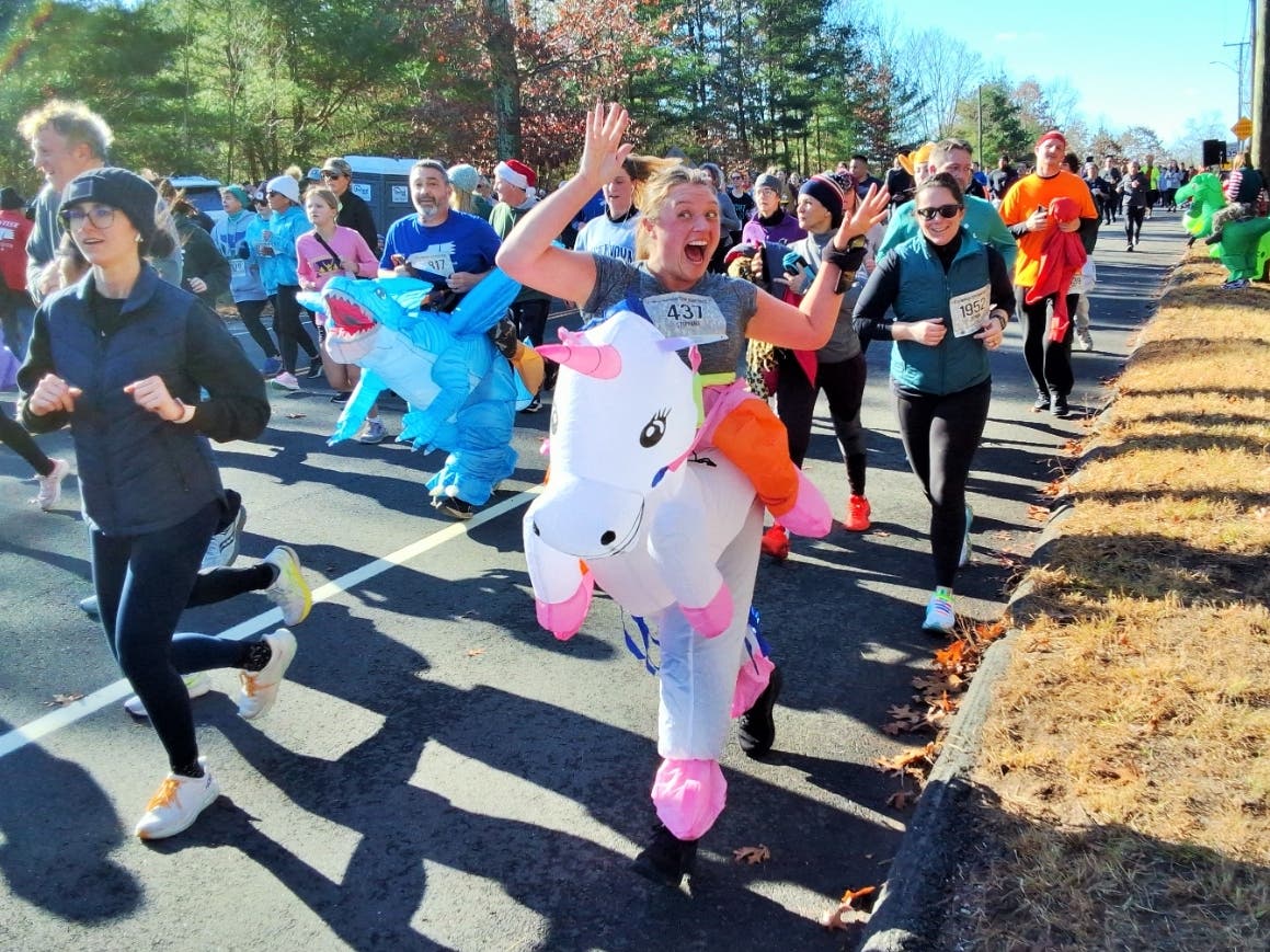 An enthusiastic unicorn celebrates the milestone of reaching the top of the Highland Street hill alive.