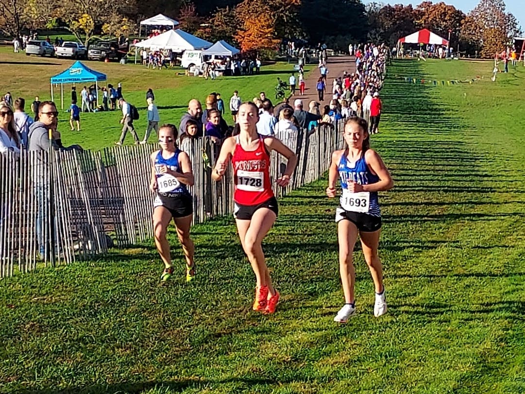 Stephanie Burzynski (#1728) was one of four Somers High School girls cross country runners to be accorded All-State honors.