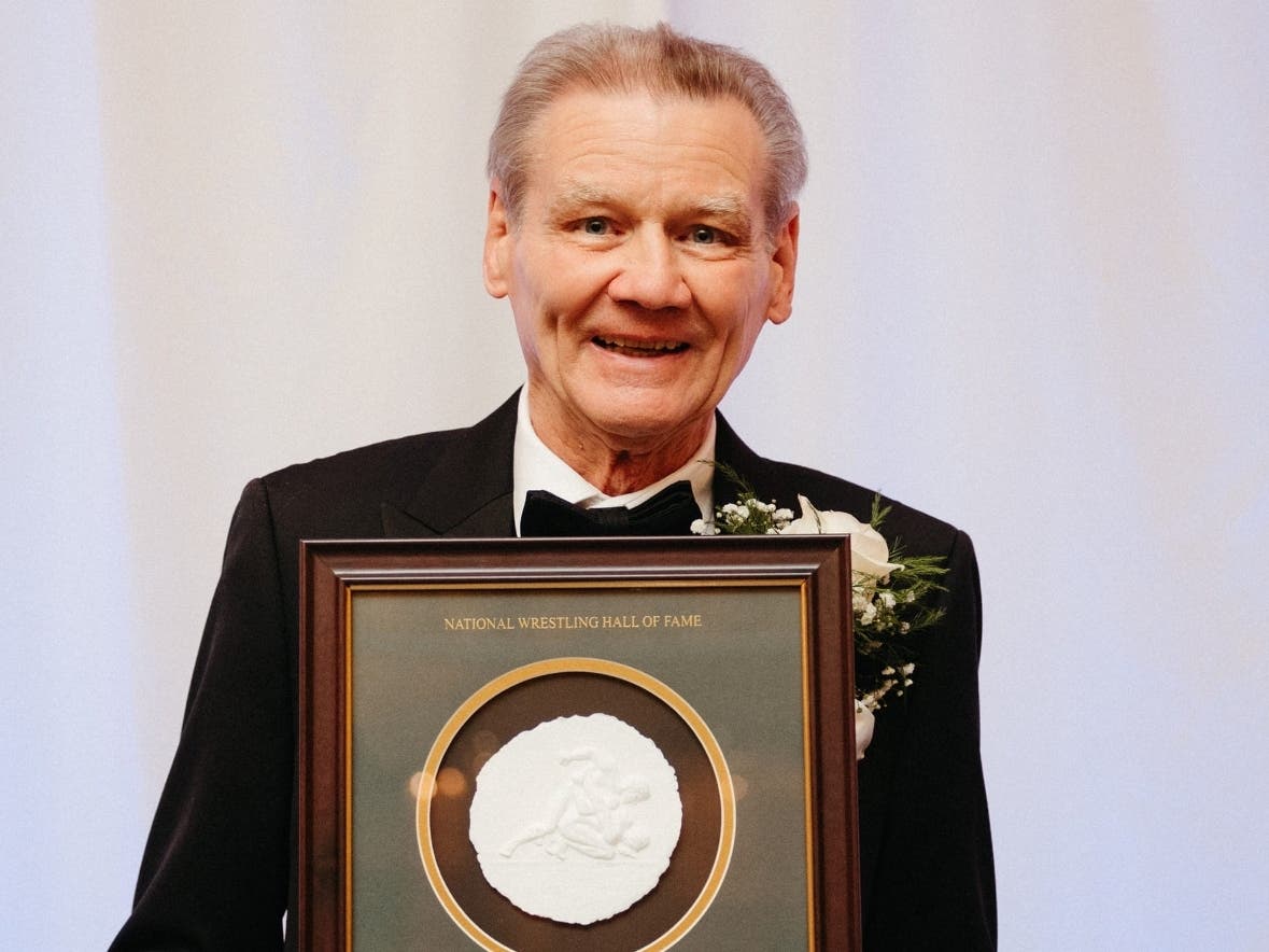Ben Aleks with his plaque from the National Wrestling Hall of Fame and Museum, into which he was inducted in 2022.