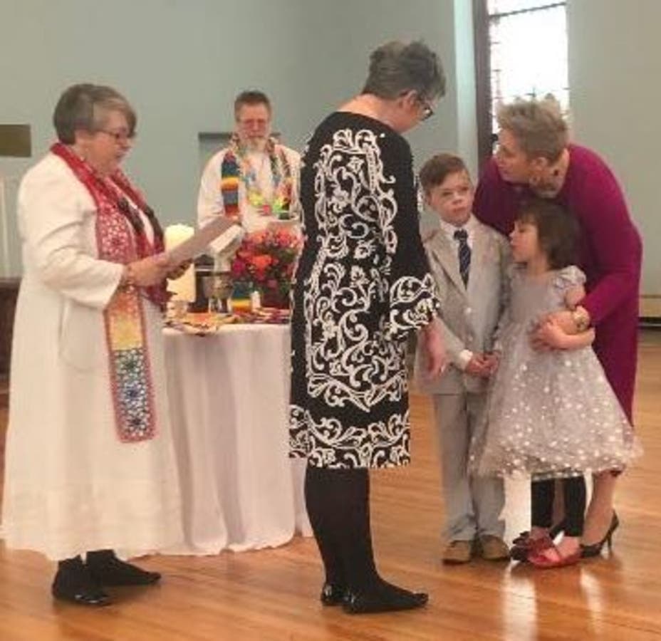 With the Rev. Mary Kay Totty, Jennifer and Amy Stapleton celebrate their 15th wedding anniversary.