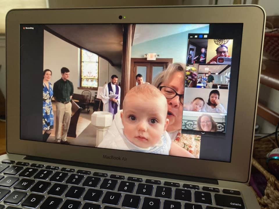 Owen Quinn is baptiaed during online church service.